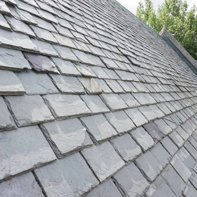 Natural slate roof laid in even courses